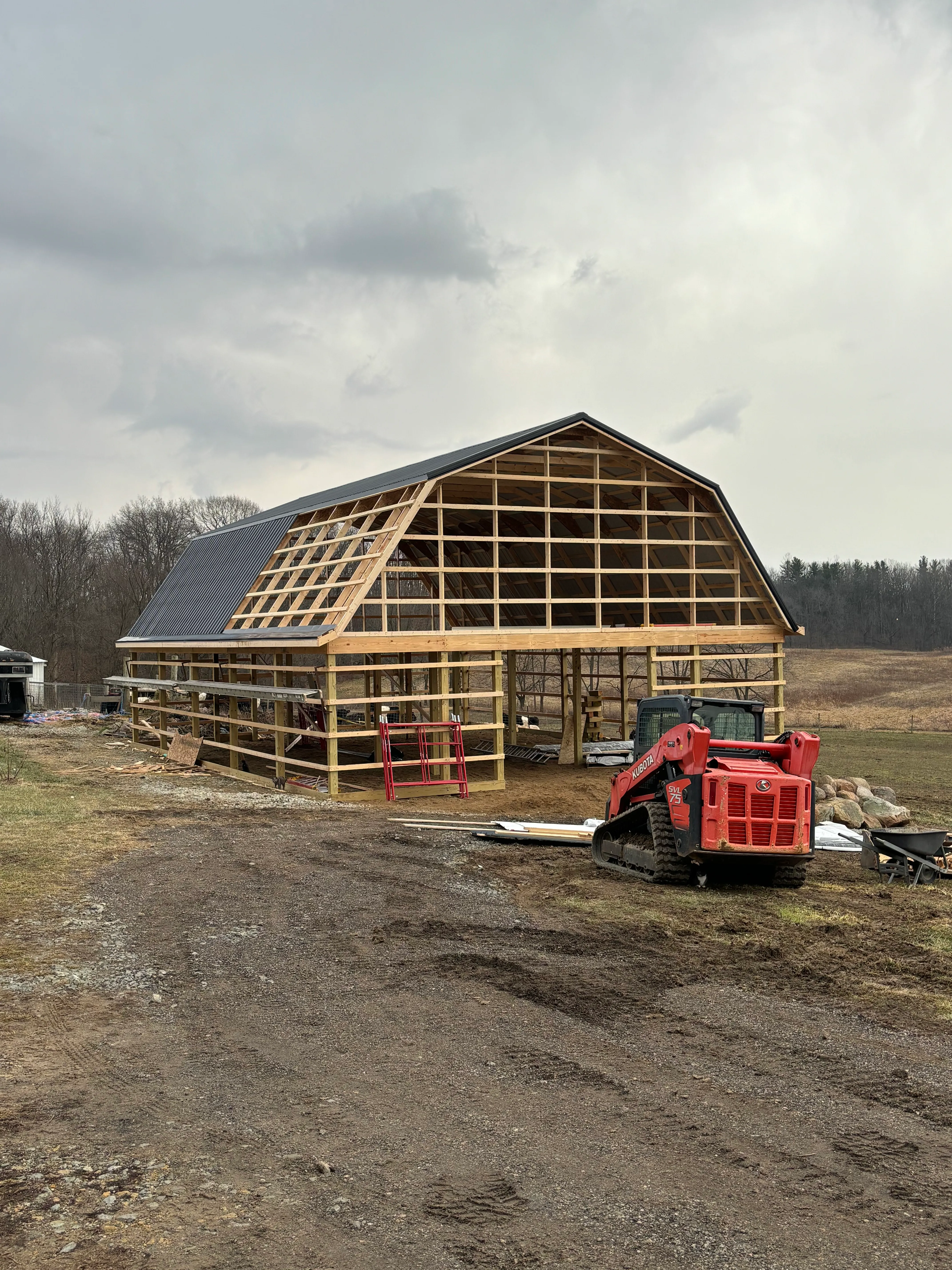 Gambrel pole barn framing